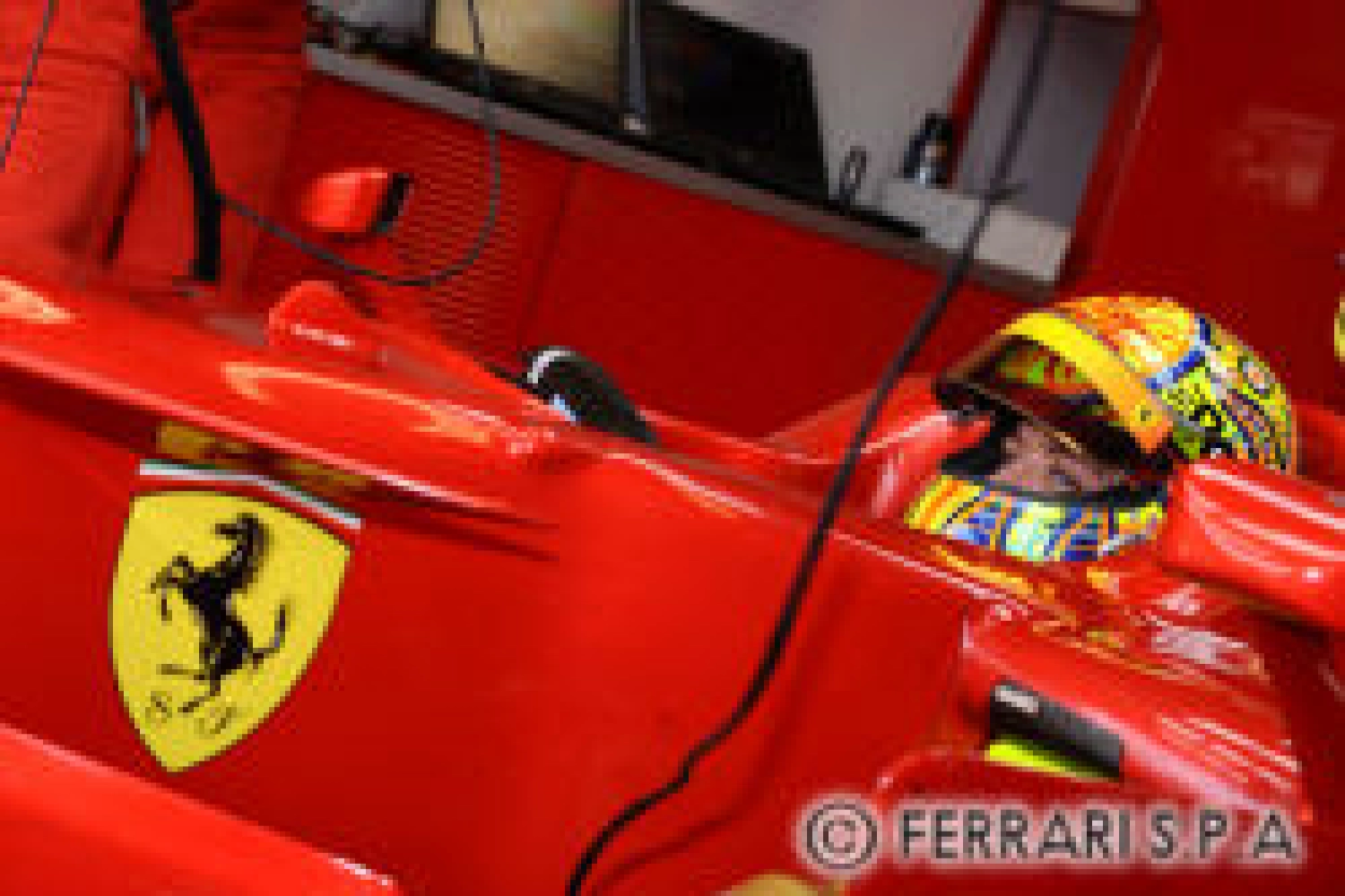 Rossi with a number 46 by Ferrari at Mugello