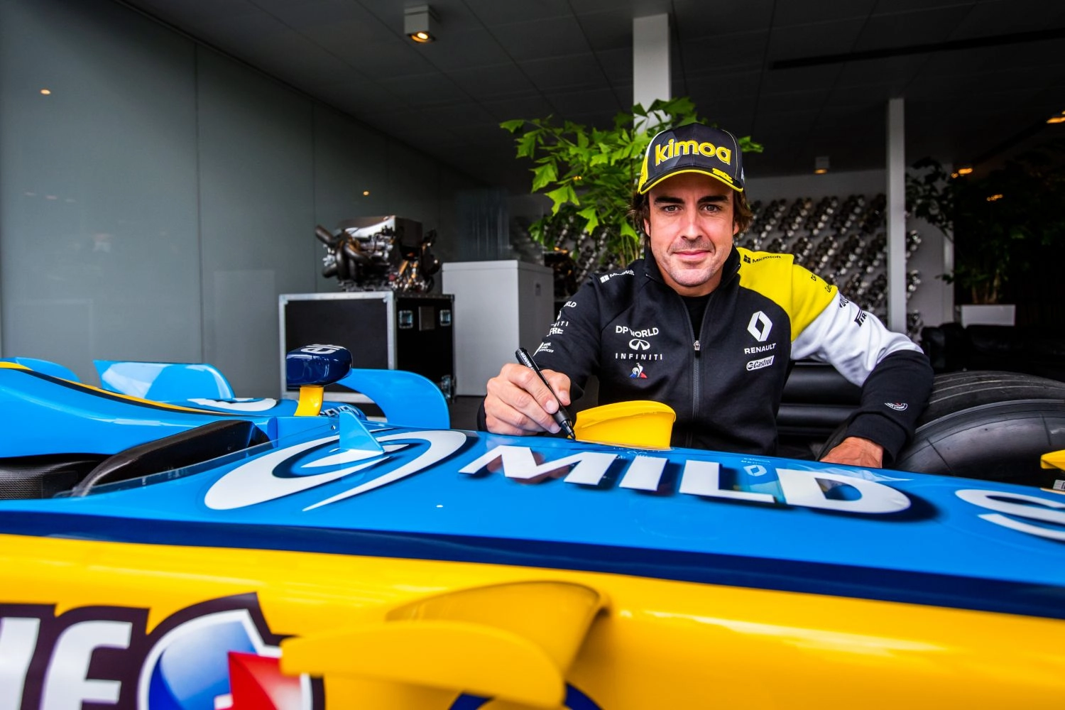 Alonso at the wheel of the R25 for a handover in Abu Dhabi