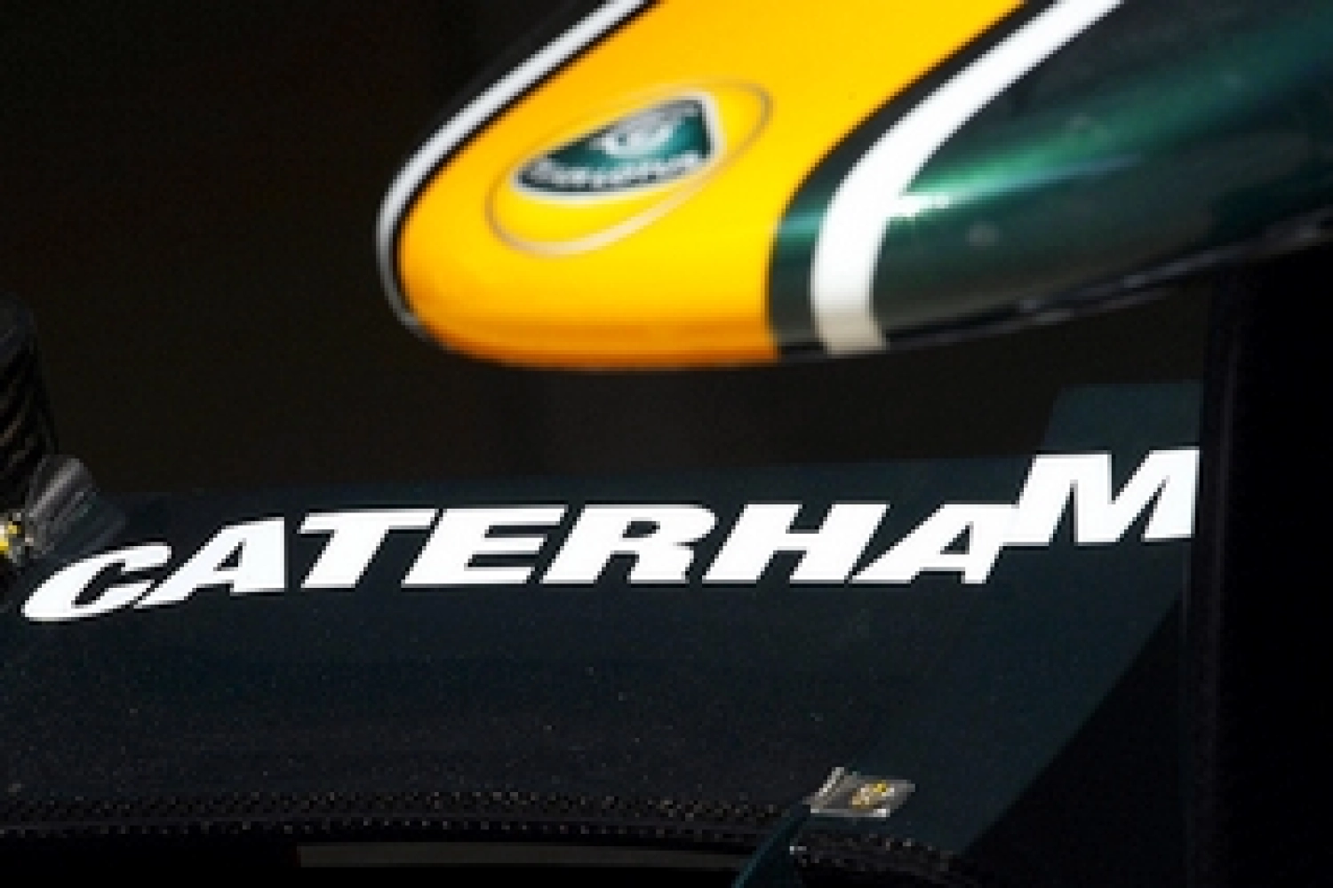 Caterham en vert et jaune avec Kovalainen et Trulli en 2012